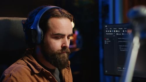 Developer Listening Music and Drinking Coffee While Doing Programming