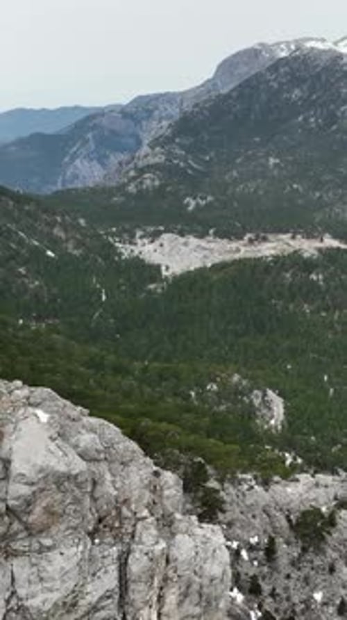 Vertical Video Aerial Winter Escape Dramatic Mountains River and Cinematic Waterfalls