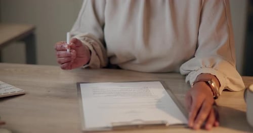 Person Signing Contract in Modern Workplace Office