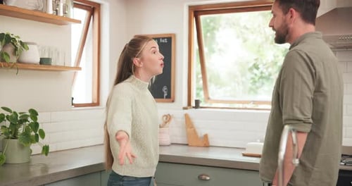 Couple Arguing in Modern Kitchen