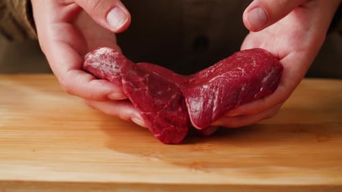 Man Chef Cooking Beef Steak Angus Closeup Macro Professional Cheif Preparing Meat in Restaurant