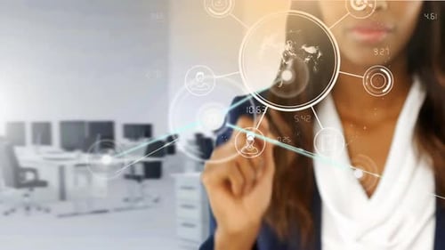 Animation of network of connections over businesswoman touching interactive screen in office