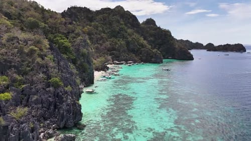 Turquoise Waters Banul Beach in Coron, Philippines with Traditional Boats