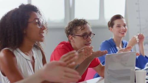 Corporate Team Discussing Business Strategy in a Bright Office
