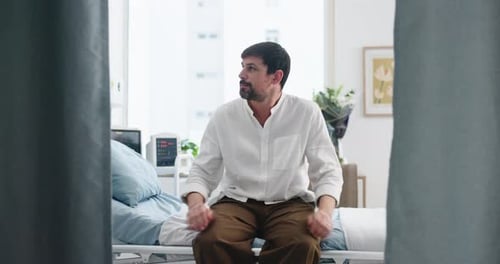 Thinking, patient and man in hospital room, anxious and waiting for appointment, stress and illness