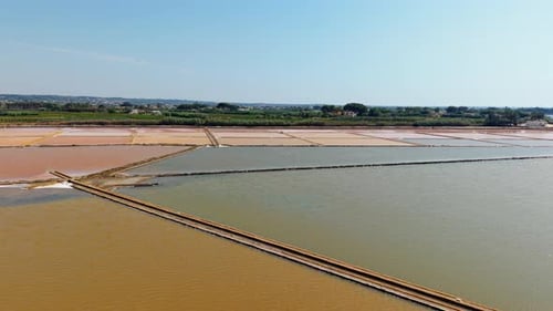 Colorful salt pans in Sicily, Italy - aerial drone view