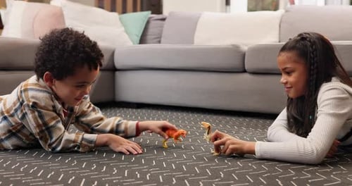 Children, relax and play with dinosaur in home for fun activity, imagination