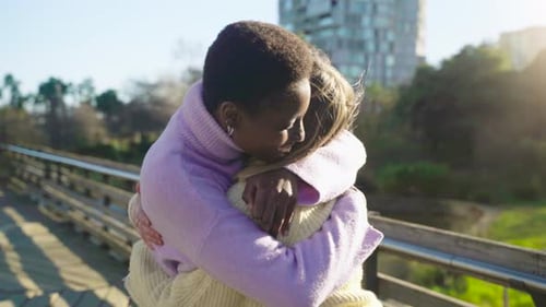 Two Girls Friends Hugging Affectionately Happy Smiling