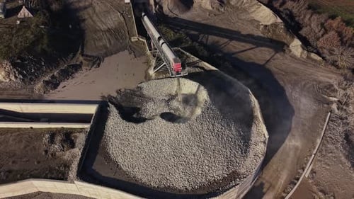 Quarry site with conveyor system delivering materials near mining area