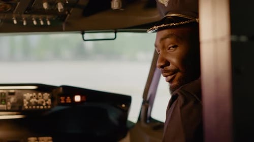 Smiling Airplane Pilot Inside Plane Cockpit