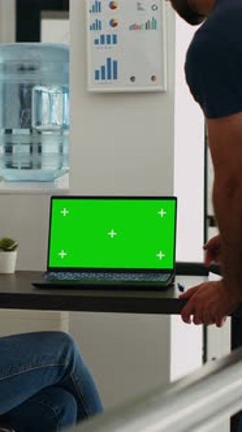 Discussing Business on Laptop with Green Screen