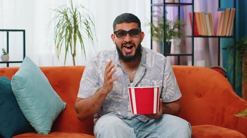 Man Watching Movie at Home with Popcorn