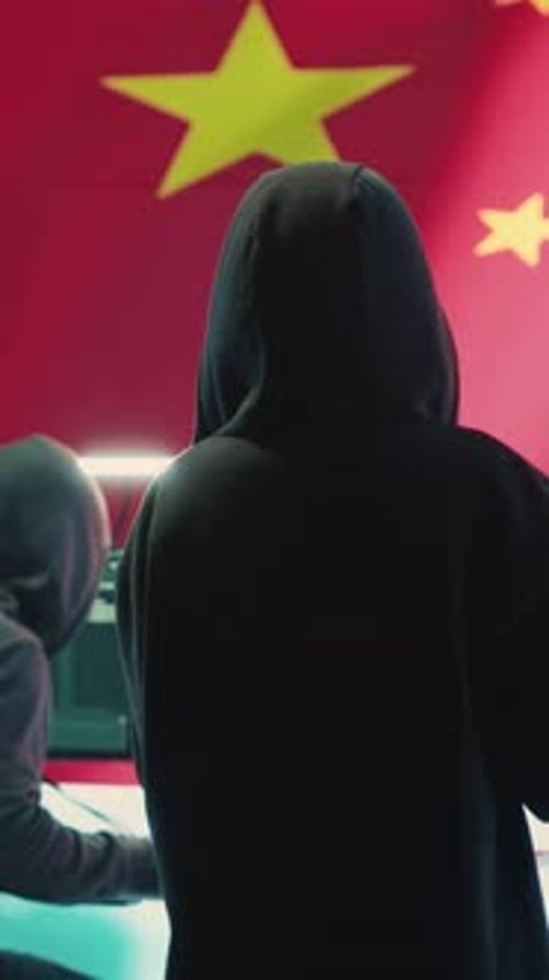 Vertical Video Terrorist Person in a Chinese Cyber Security Room Hacking National Systems