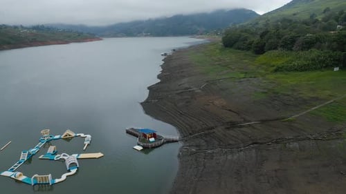 Aerial Flying Over Lake with Clouds Near Lakeside