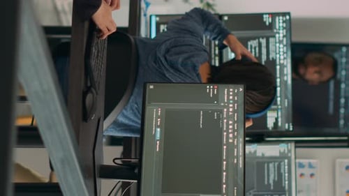 Programmers Working on Computers in the Office