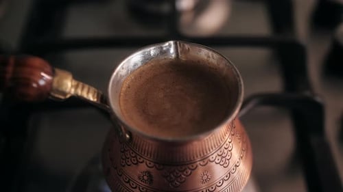 Preparing Natural Coffee at Home Making Coffee in a Traditional Copper Cezve