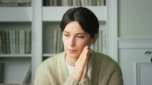 Close-up of upset girl sad tense sitting at home