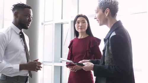 Business teamwork in office lobby with lens flare for corporate meeting