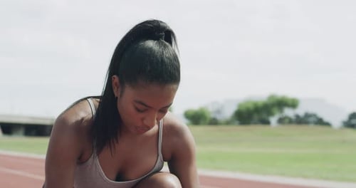 Woman, sports and runner in start for race, sprint or athletics in outdoor competition on stadium