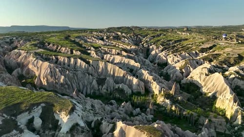 Hot Air Balloons Fly Over the Mountainous Landscape of Cappadocia Turkey