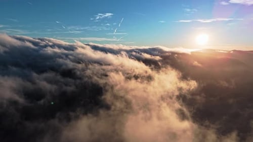 Stunning Aerial Sunset Capturing the Peaceful Beauty Above the Clouds