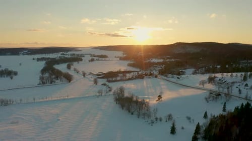 Snowy Rural Landscape at Winter Sunrise