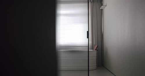 Chic Minimalist Bathroom with Freestanding Tub and Window