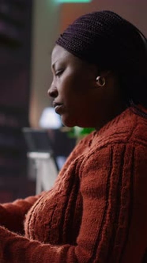 Vertical Video Confident Tutor Reading Notes and Preparing Teaching Materials at a Library Desk
