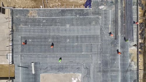 Aerial View Construction Workers Prepping Rebar and Floor for the Next Stage of Work