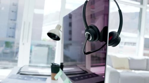 Call center, headset and computer screen for desktop support or customer service on office desk