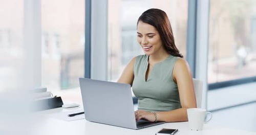 4k video footage of an attractive young businesswoman working in her office