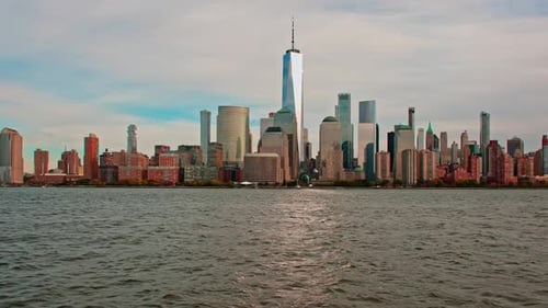 New York Skyline Rises Above River New York City Glows in Sun New York Towers Shape Skyline New York