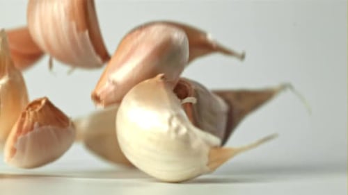 Fresh Garlic Falls on the Table Filmed on a Highspeed Camera at 1000 Fps