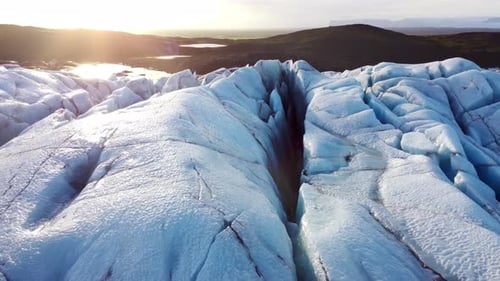 Aerial View of Glacier at Sunrise
