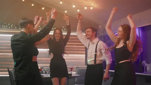 Happy Students Dancing in Modern Club Cheerful Men and Women Dancing Listening to Music Having Fun