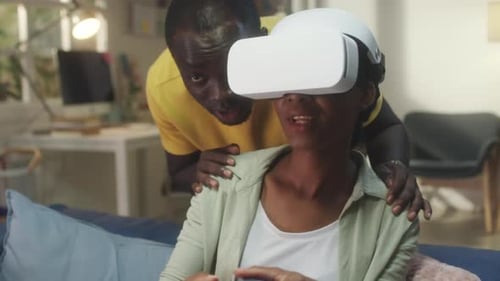 Couple Relaxing at Home with Virtual Reality Headset