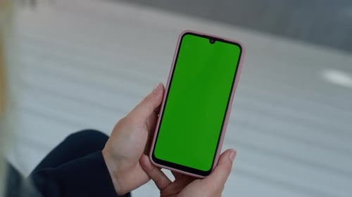 Phone With Green Screen Being Held Vertically
