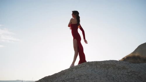 Dancer In Red Dress Moves Sinuously On The Hill In Sicily
