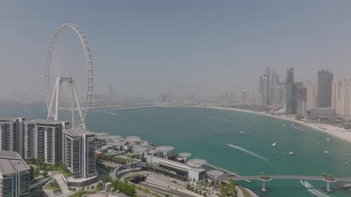 Aerial video of the Dubai Marina with the famous Ain Dubai giant wheel