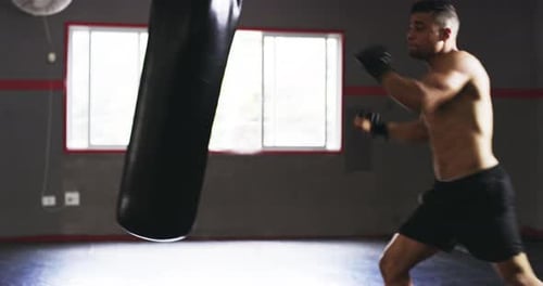 4k video footage of a young male boxer practicing in the gym