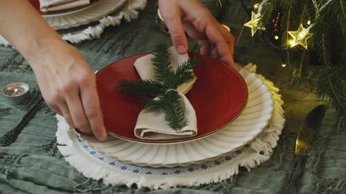 Festive Christmas Table Setting with Plates and Decor