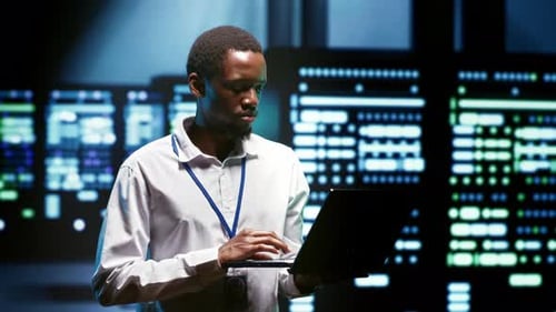 Expert Using Tablet to Analyze Servers