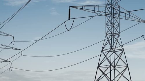 Electrical Transmission Towers Against Cloudy Sky Panning Shot
