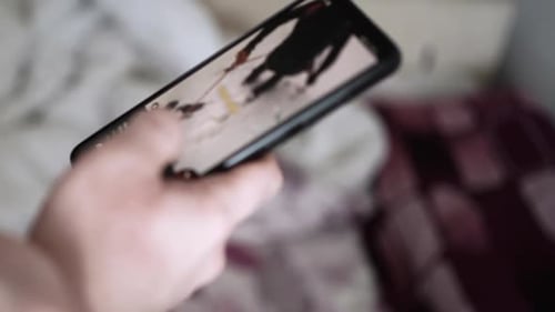 Man scrolling social media in smartphone