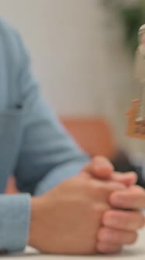 Close Up of Senior Agent Giving Home Keys to Couple, vertical video