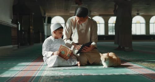 Quran, child and man teaching in a mosque for praying, peace and spiritual care in holy religion