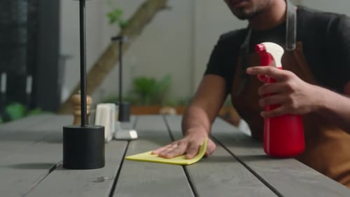 Calm Indian Arabian Ethnic Man Male Cafe Worker Waiter Guy Barista Cleaner Cleaning Table Wiping