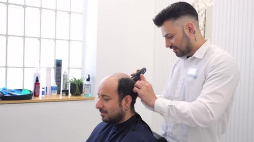 Hair Clinic Technician Preparing Scalp for Hair Implant