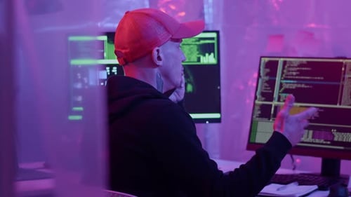 Programmer Working at Computer at Night