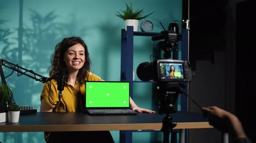 Woman Presenting Product on Laptop with Green Screen